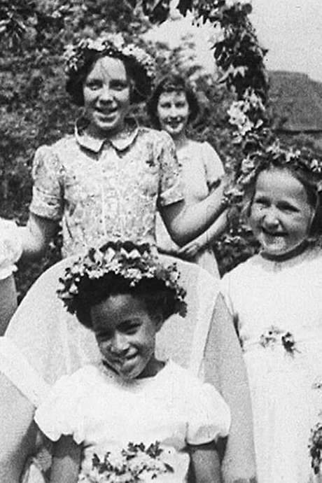    An extraordinary and unexpected snapshot of rural life in wartime in which a young black girl is crowned Queen of the May.  